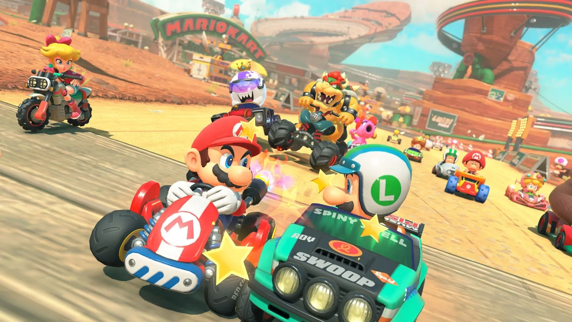 Các nhân vật đua xe trên đường đua đầy màu sắc và chướng ngại vật trong Mario Kart World