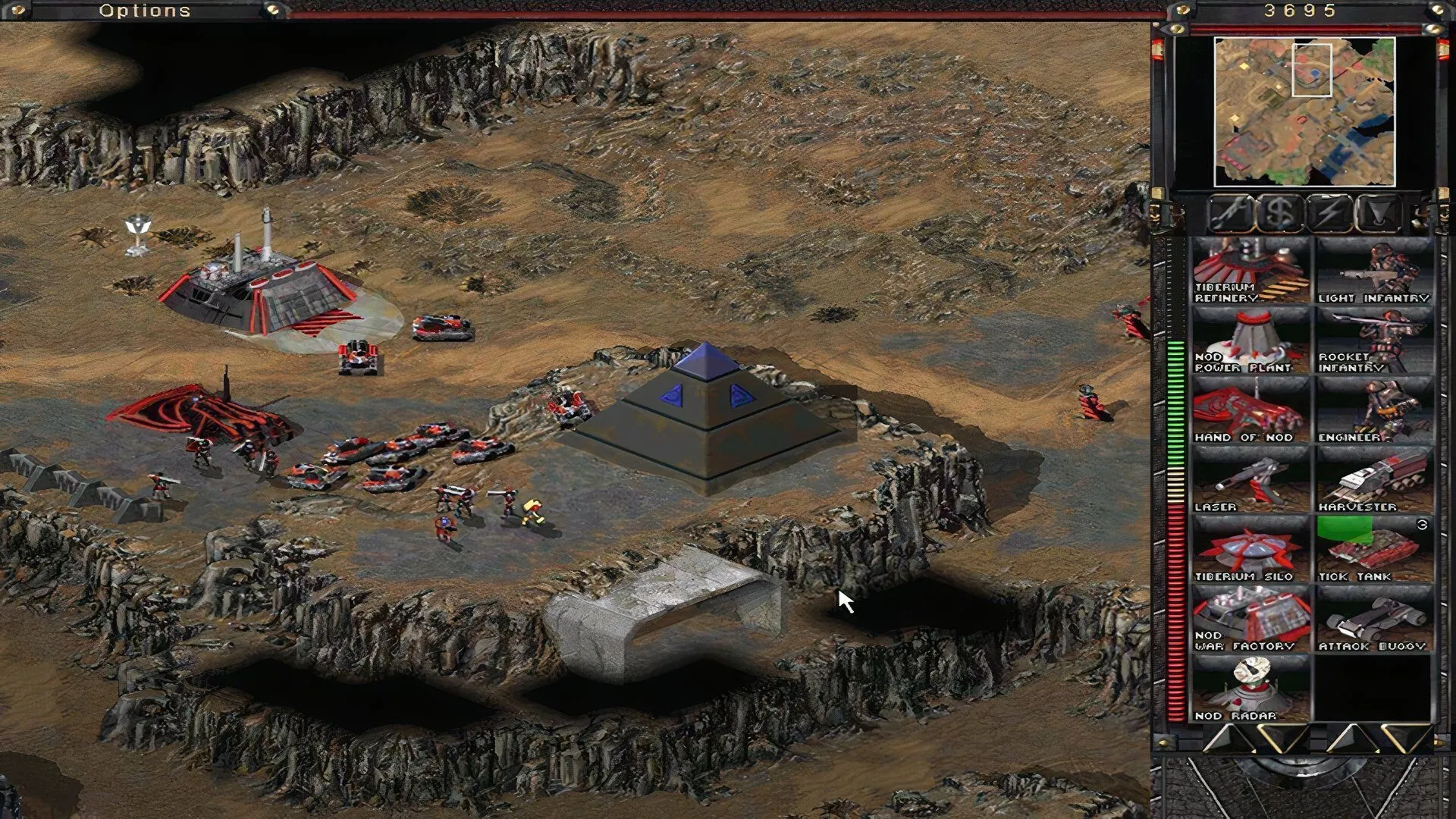 Đơn vị quân đội của Brotherhood of Nod di chuyển trên bản đồ đầy tiberium trong C&amp;C: Tiberian Sun.
