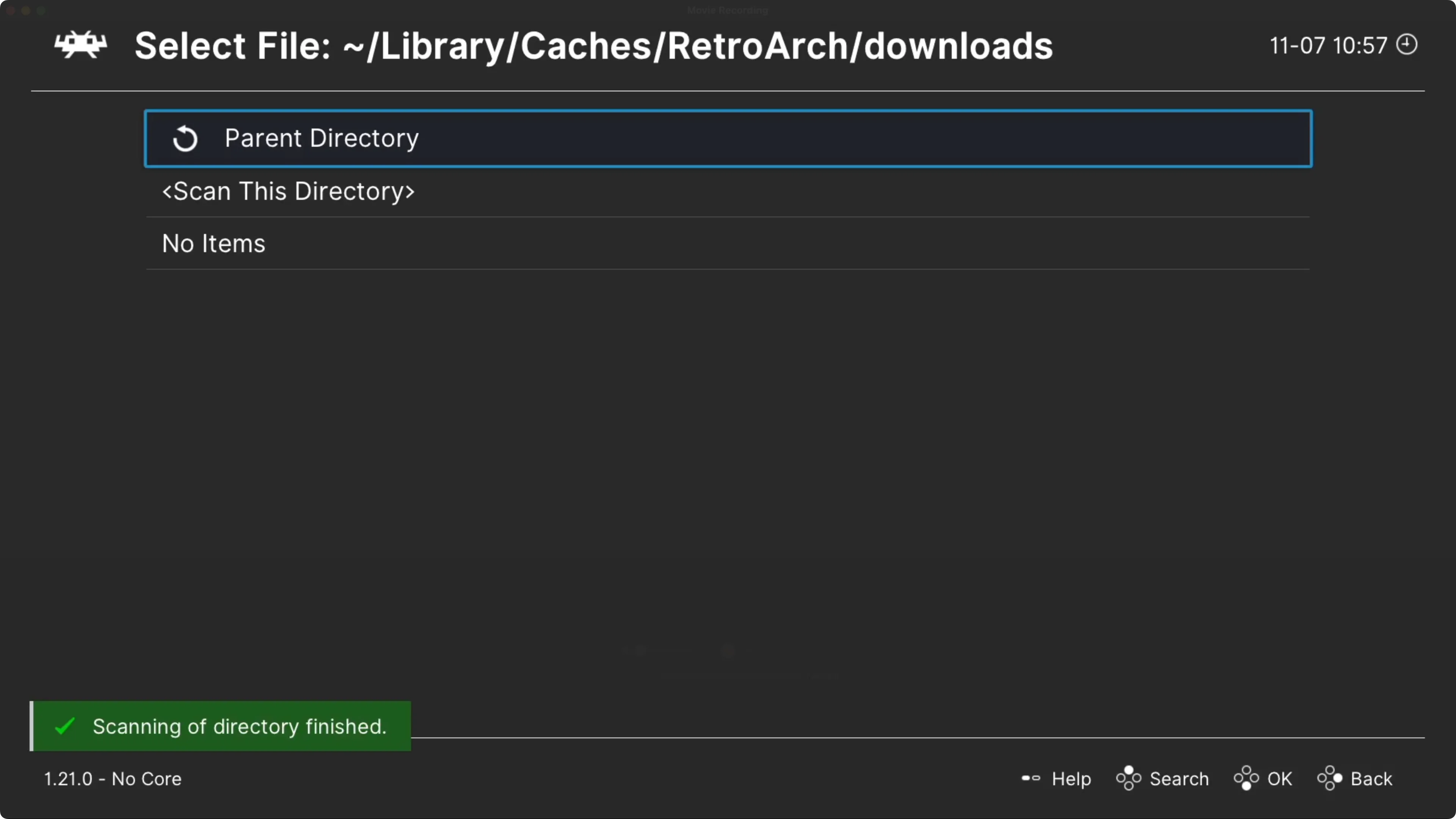 Màn hình ứng dụng RetroArch trên Apple TV hiển thị quá trình quét và thêm nội dung game mới vào danh sách phát