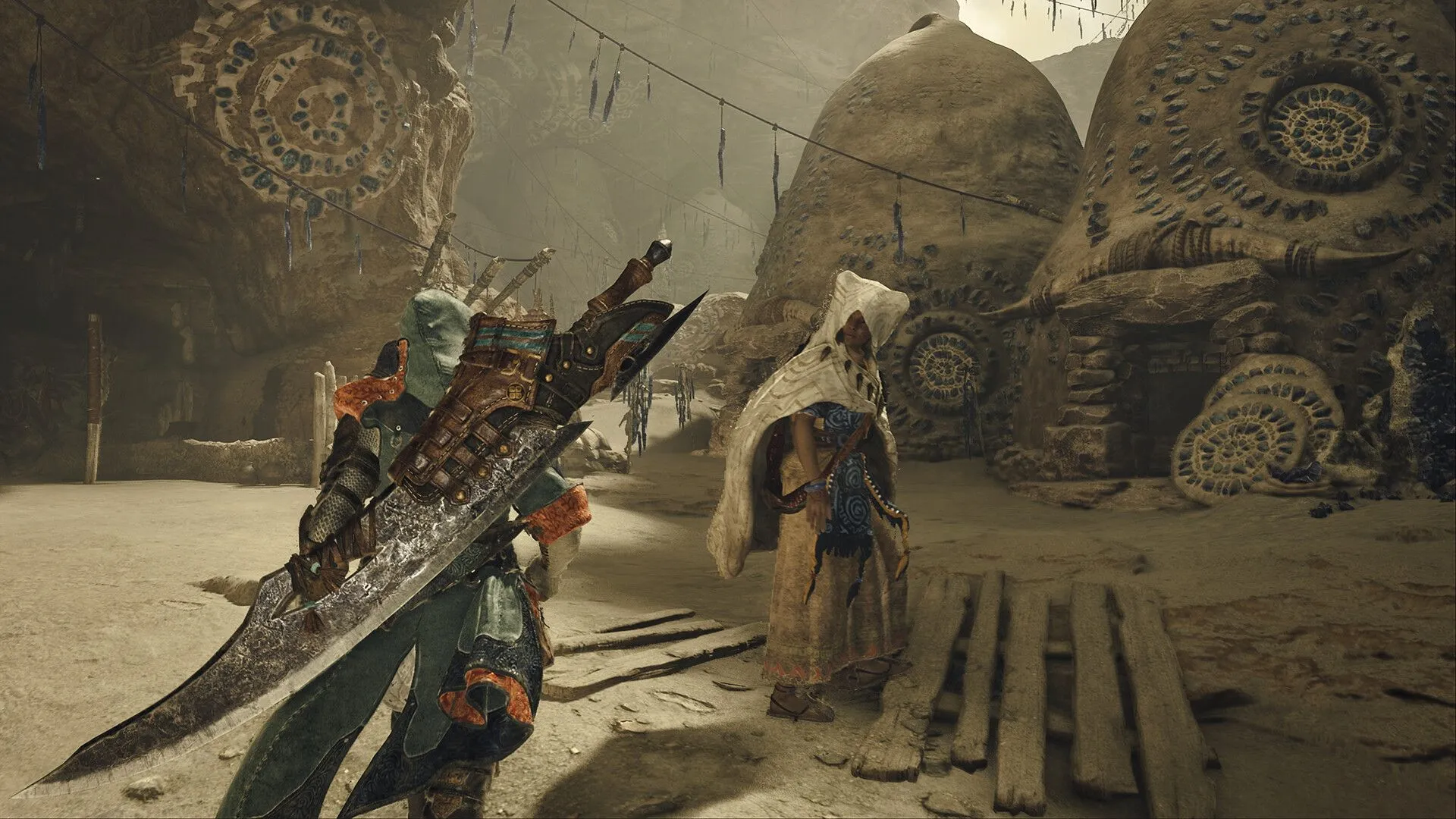 Thợ săn chuẩn bị chiến đấu với quái vật trong bối cảnh sa mạc của Monster Hunter Wilds