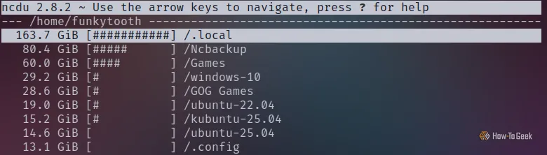 Ảnh chụp màn hình terminal Linux hiển thị kết quả quét của ncdu với các thư mục game lớn và thư mục cục bộ chiếm nhiều dung lượng