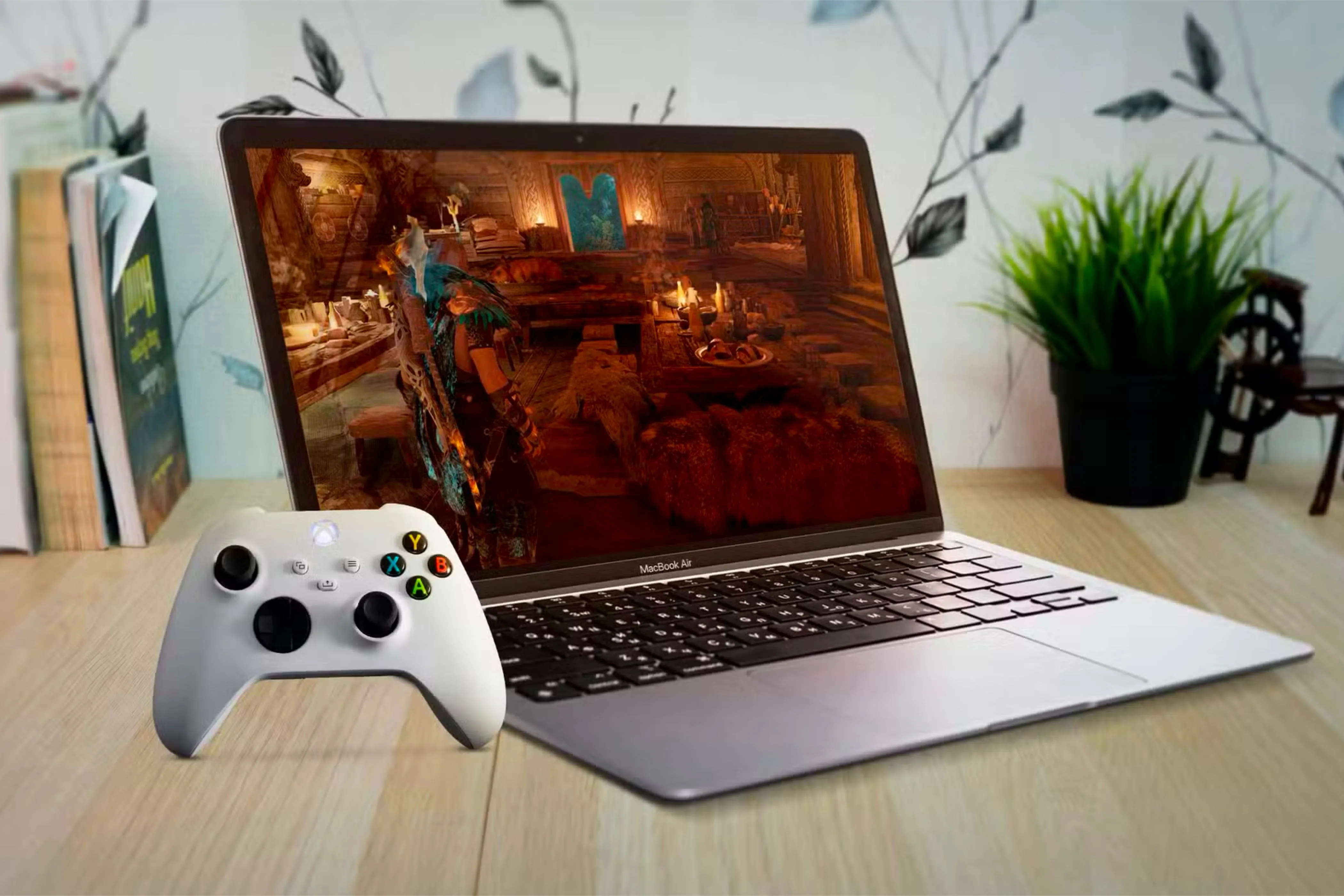 MacBook Air hiển thị game với tay cầm Xbox, minh họa tiềm năng chơi game nhưng vẫn được dùng chủ yếu cho công việc.