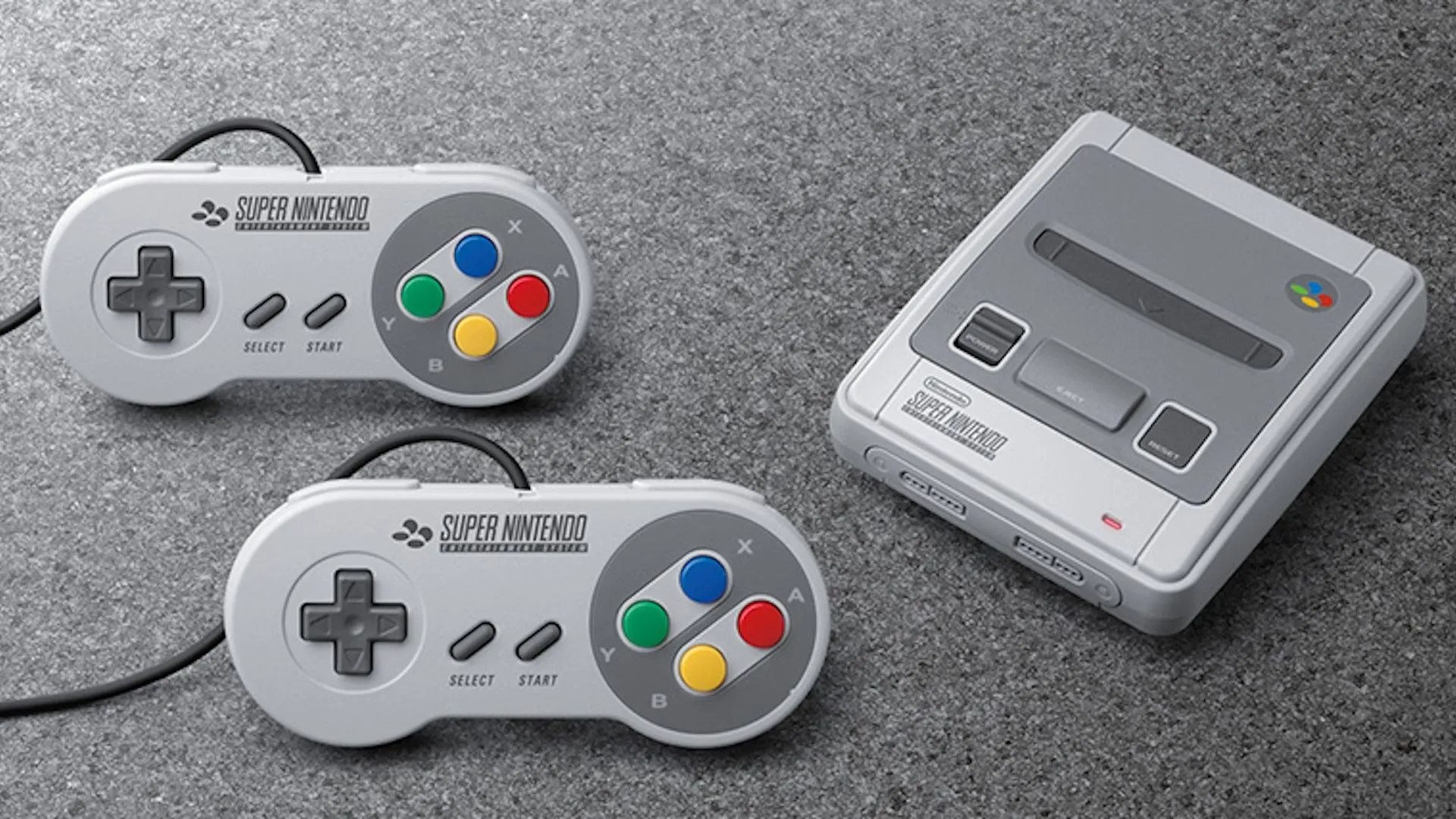 Máy SNES Classic và hai tay cầm của nó đặt trên một tấm thảm