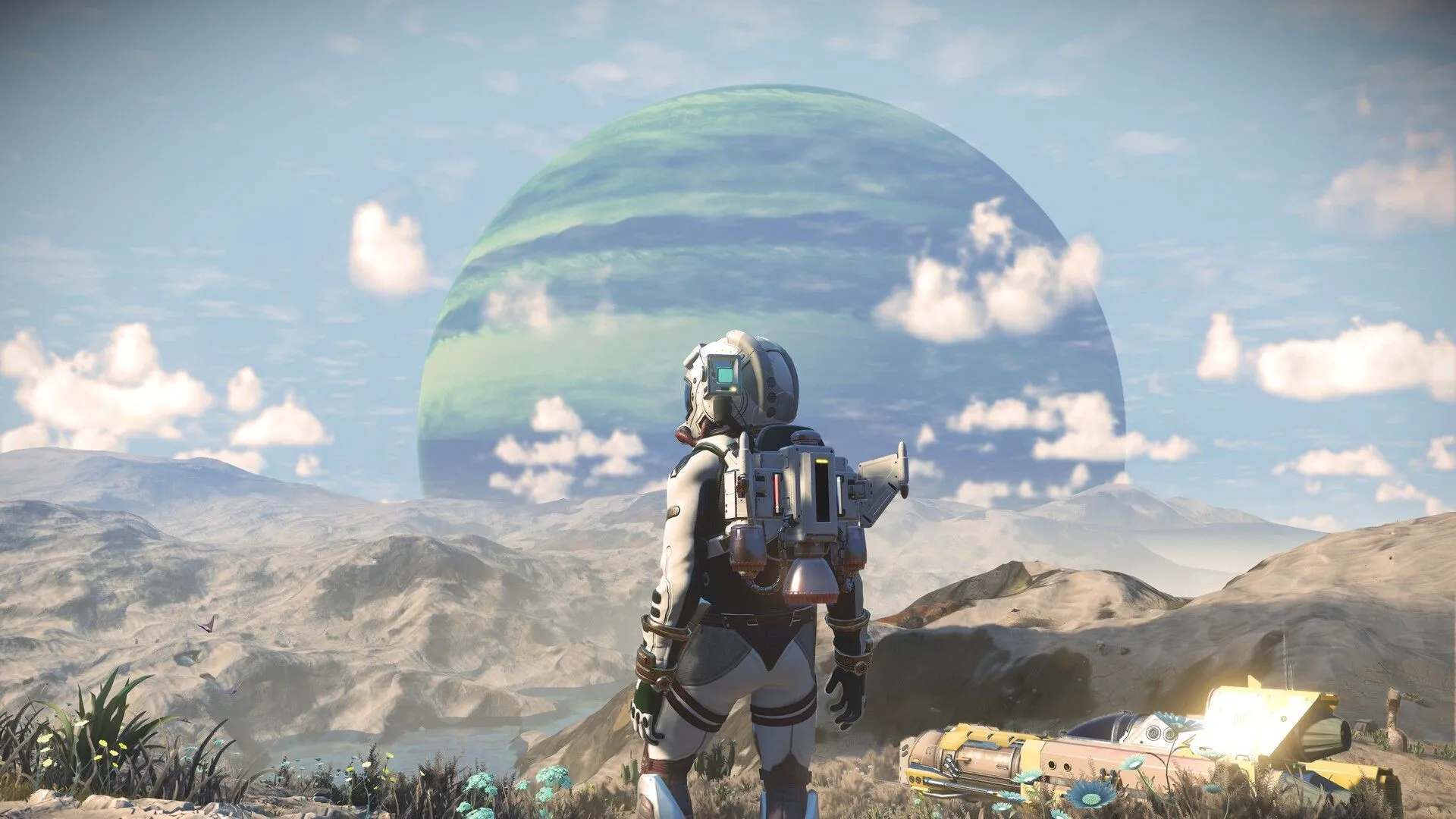 Nhân vật trong bộ đồ du hành vũ trụ nhìn ra hành tinh ngoài hành tinh trong game No Man's Sky, minh họa công nghệ tạo hình ngẫu nhiên của tựa game indie này.