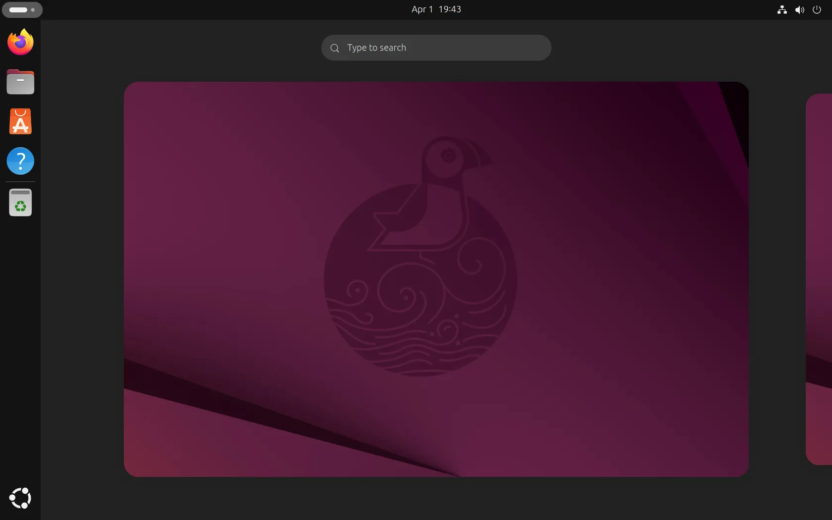 Tổng quan giao diện máy tính để bàn của Ubuntu phiên bản 25.04, với thanh dock bên trái và các biểu tượng ứng dụng.