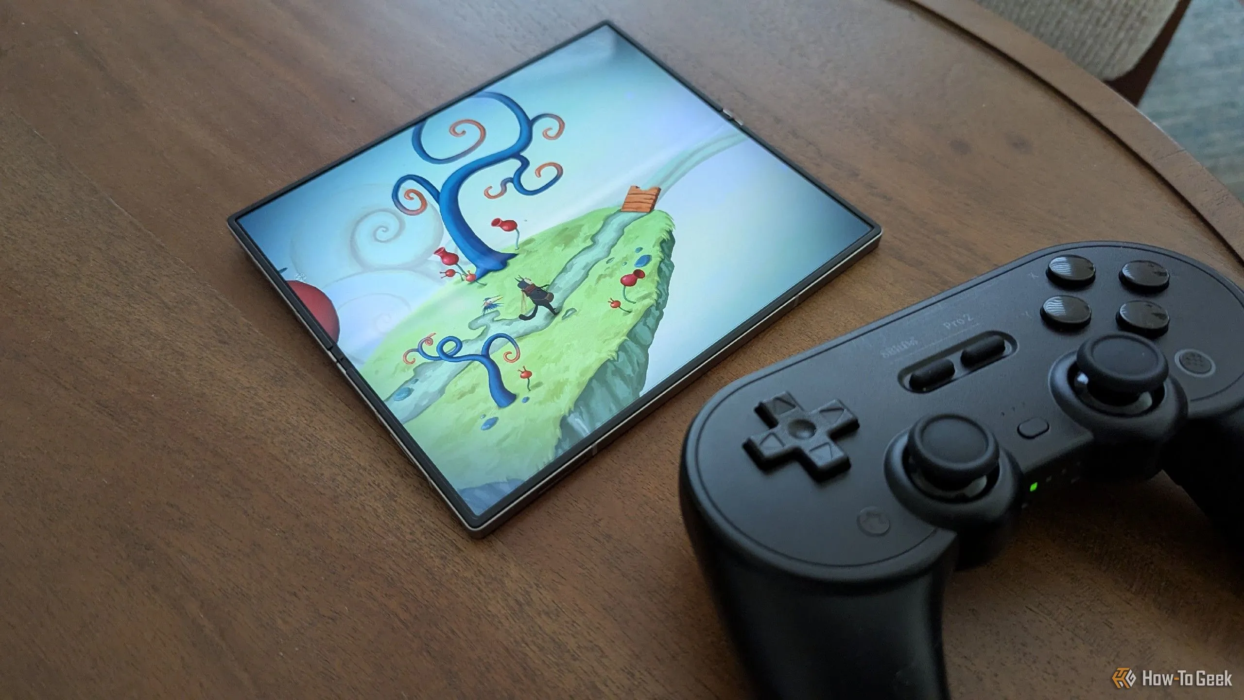 Tựa game Figment trên Galaxy Z Fold 6 cùng tay cầm 8BitDo Pro 2, cho thấy sự kết hợp hoàn hảo giữa điện thoại gập và phụ kiện chơi game chuyên nghiệp.